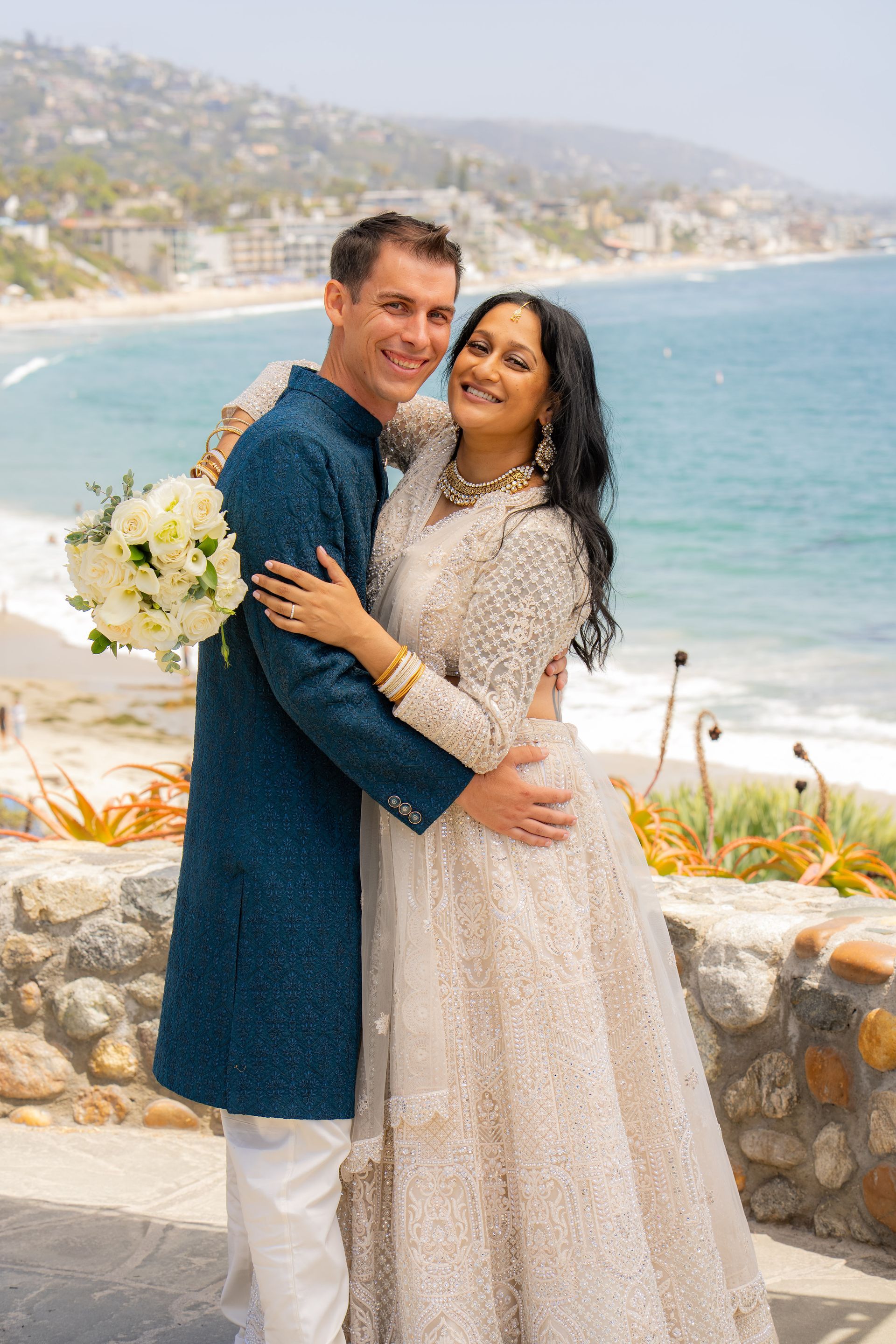 laguna beach elopement photographer Bride and groom after civil ceremony in Laguna beach wearing traditional Indian saree wedding dress