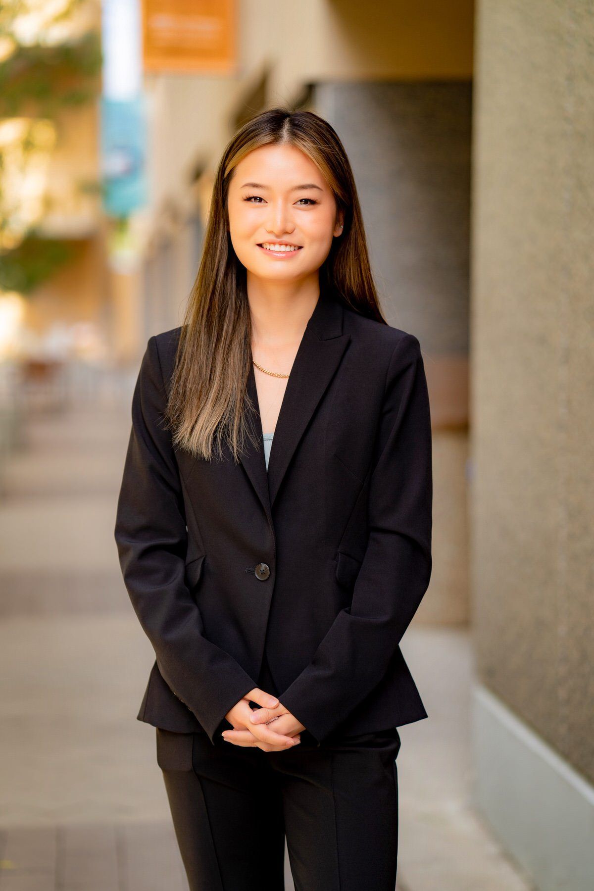 An outdoor headshot example of a young female college professor