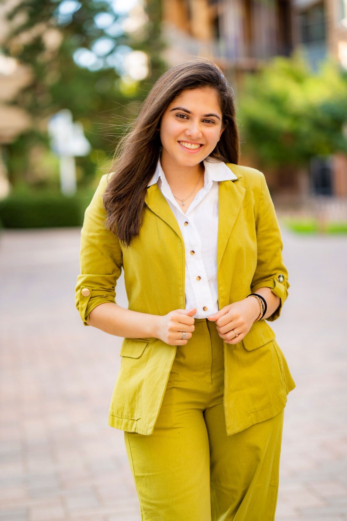 A lifestyle headshot of a woman outdoors.