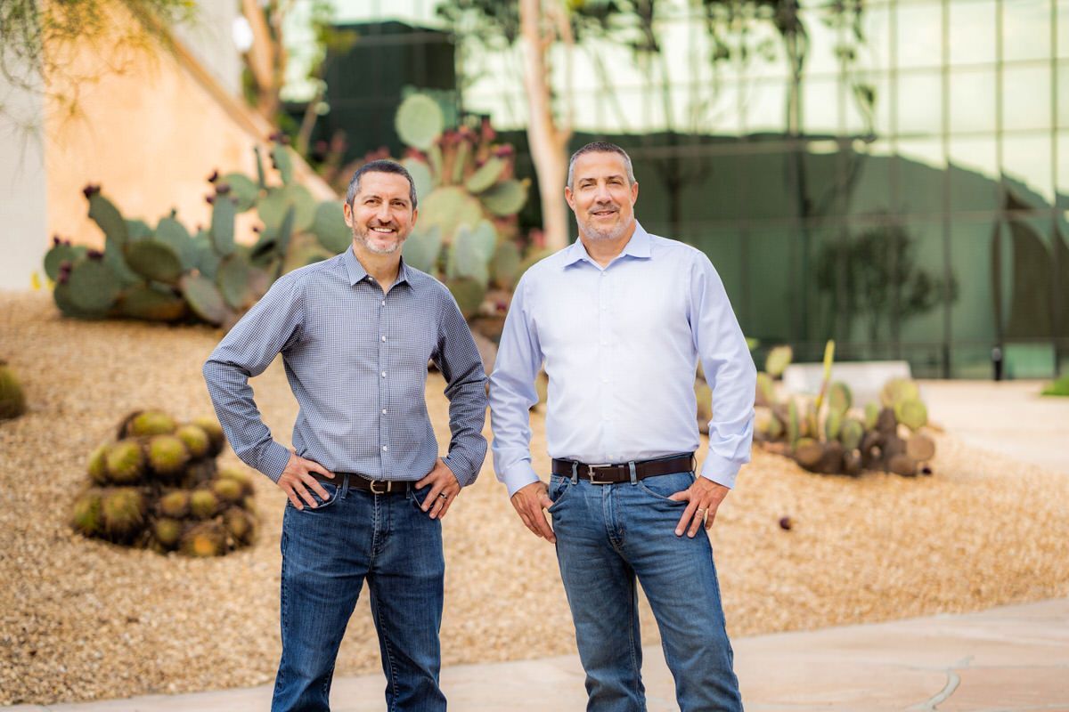 Noguchi Garden Photo Two men are standing next to each other in front of a cactus garden at Noguchi Garden in Costa Mesa.