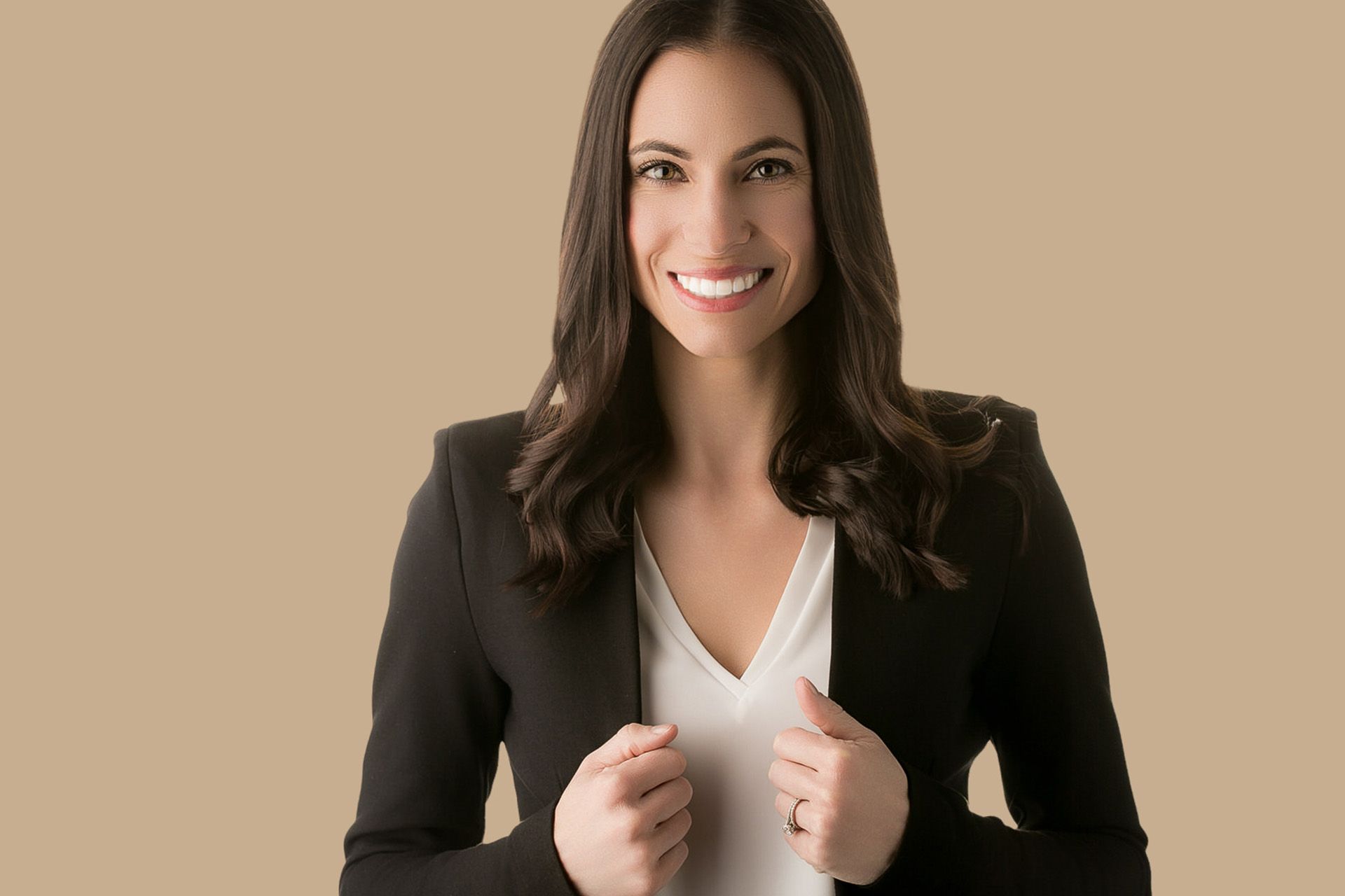 Actor Headshot Dana Point Photographer A woman wearing a black jacket and a white shirt is smiling.
