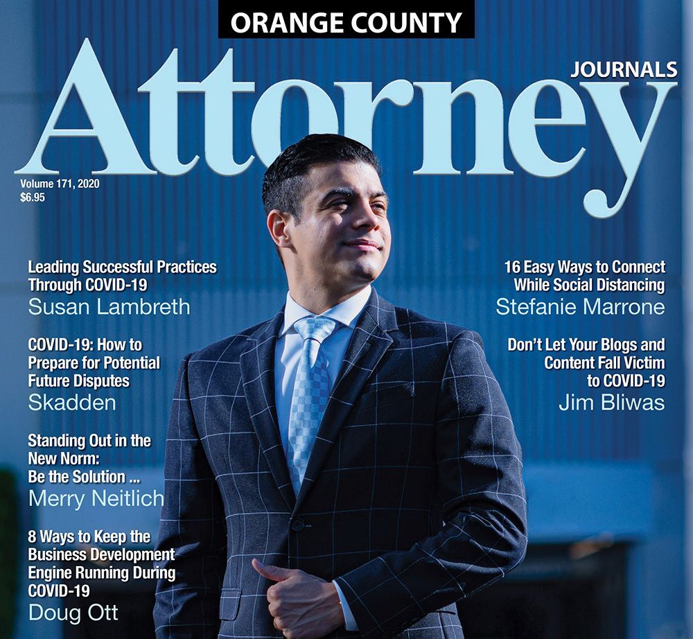 A man in a suit and tie is on the cover of an orange county attorney journal.