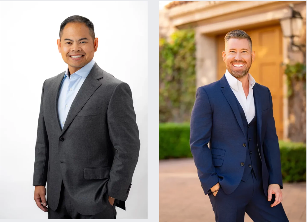 Male Corporate Headshots Two men in suits are standing next to each other and smiling.