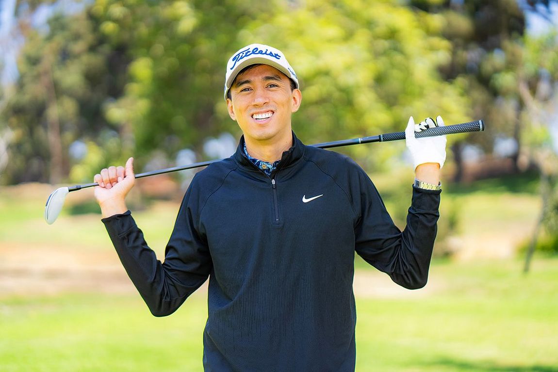 Orange County Dating Profile Photographer A man is holding a golf club over his shoulder on a golf course.