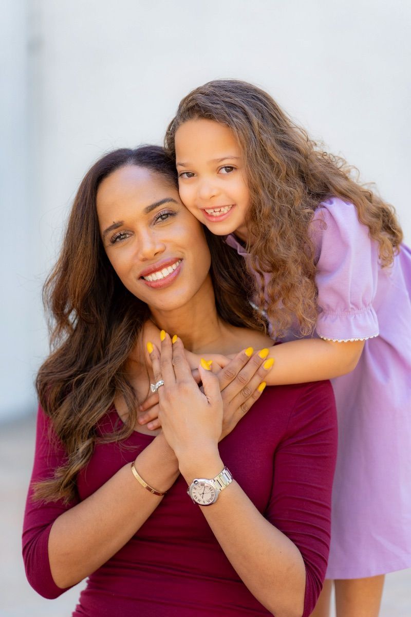 A woman and a little girl are posing at Noguchi Gardens in Costa Mesa