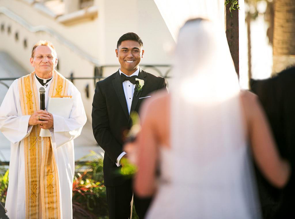 Groom waits for his bride in the lighthouse courtyard at Hyatt Huntington Beach