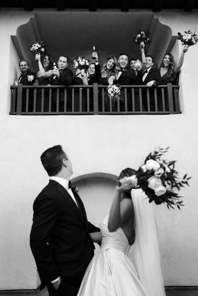 A man in a suit and tie is smiling for the camera