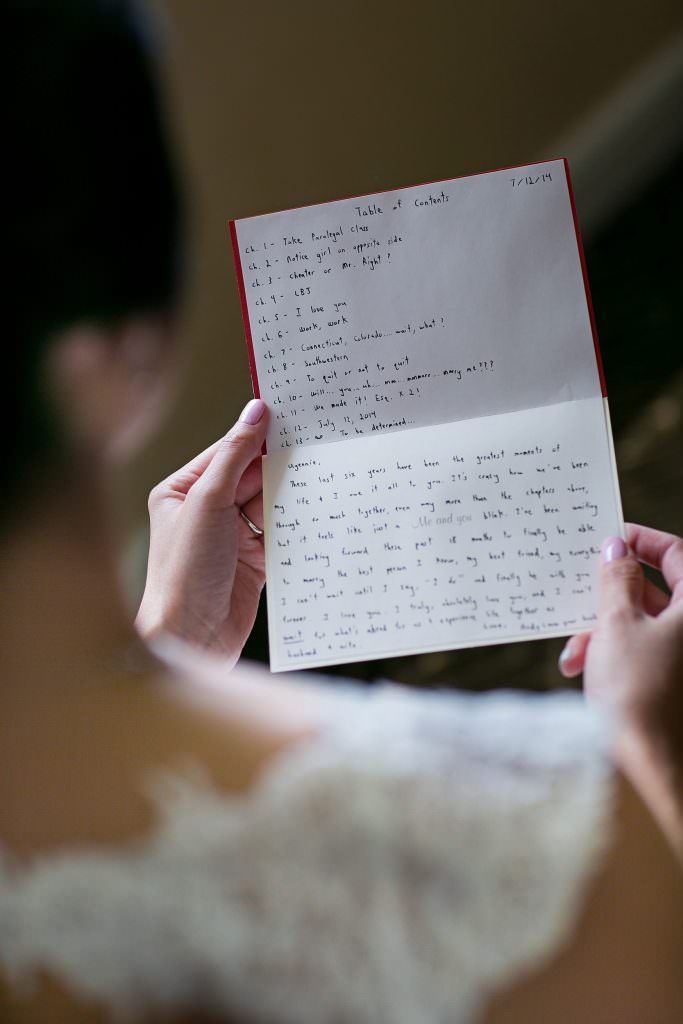 A woman is holding a letter in her hands.