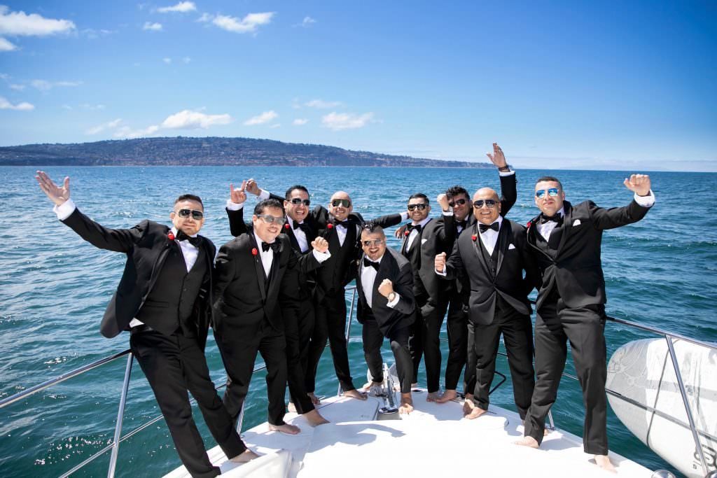 Groomsman on a boat for a Taranea wedding