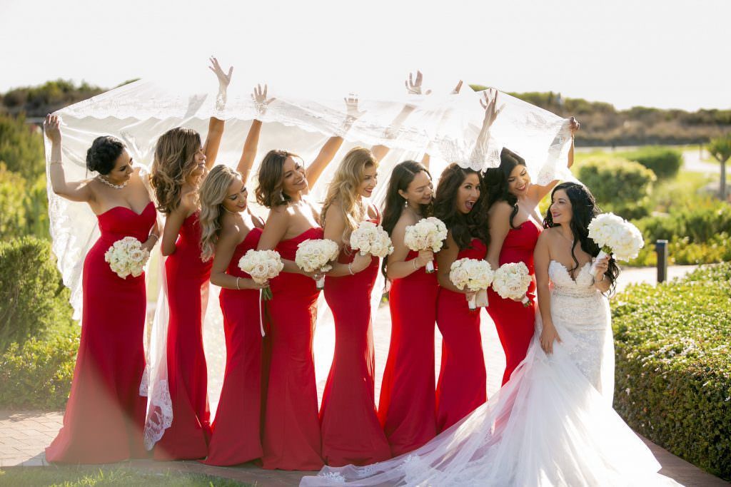 A bride and her bridesmaids are posing for a picture at Terranea Resort in Los Angeles.