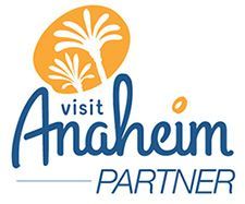 A visit anaheim partner logo with two palm trees on a white background.