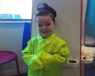 baby dressed as policeman