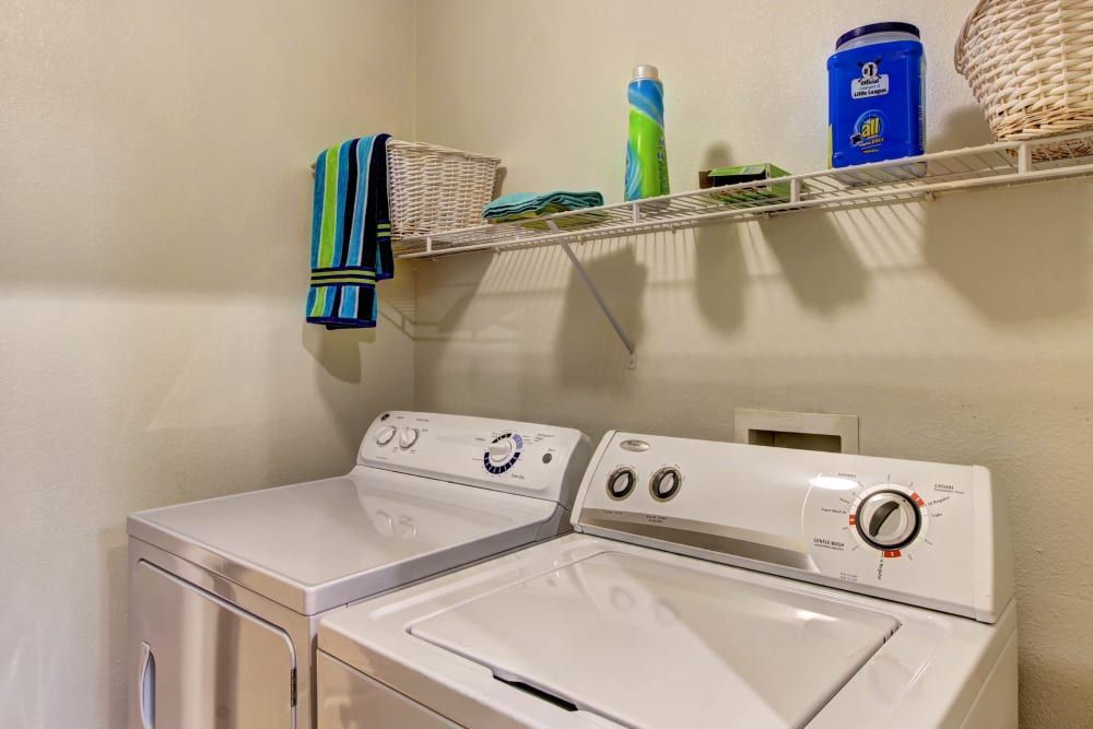 In-unit washer and dryer in the laundry room at Marquis at The Woodlands in Spring, TX.