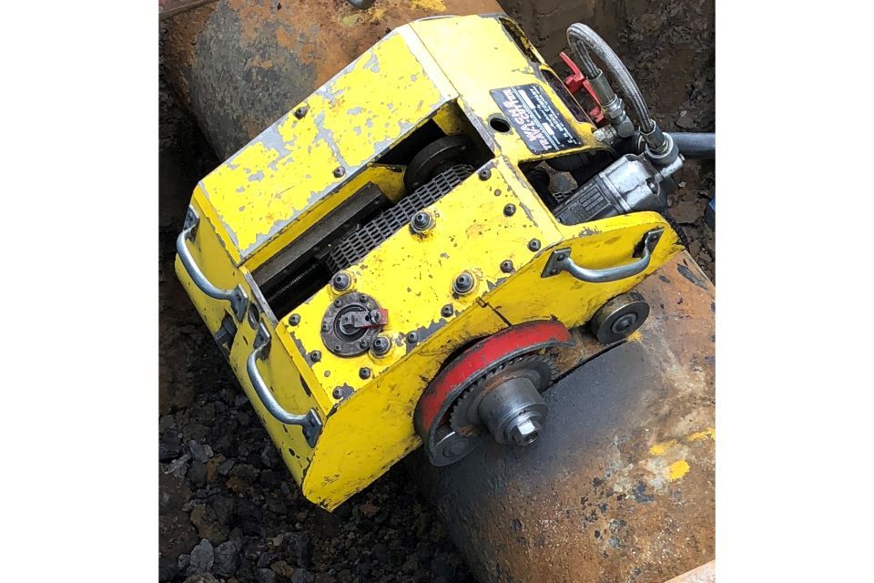 Machine being used to cut a pipe