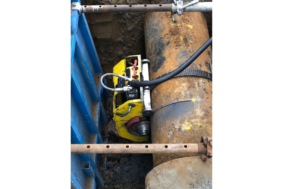 Machine being used to cut a pipe
