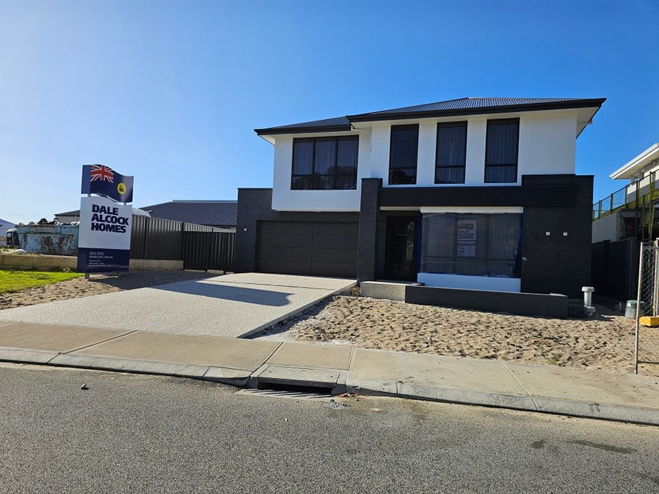 A house with a sign in front of it that says ' belle valley homes '