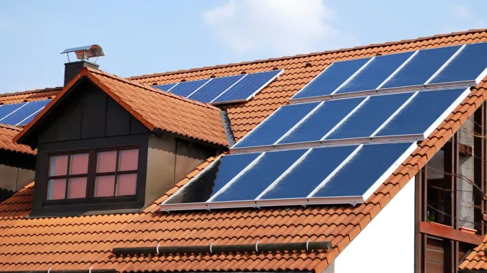 A roof with a lot of solar panels on it