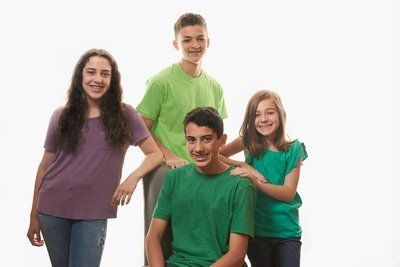 Two boys and two girls smiling — Buffalo Grove, IL — Rosen Orthodontics