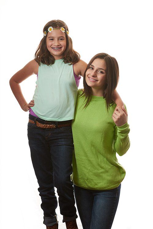 Smiling little girl with her sister — Buffalo Grove, IL — Rosen Orthodontics