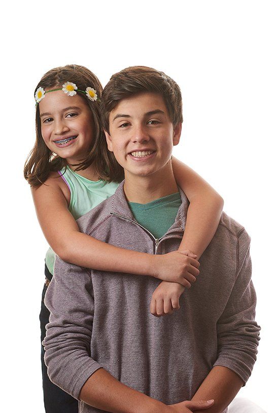 Smiling little girl with her brother — Buffalo Grove, IL — Rosen Orthodontics