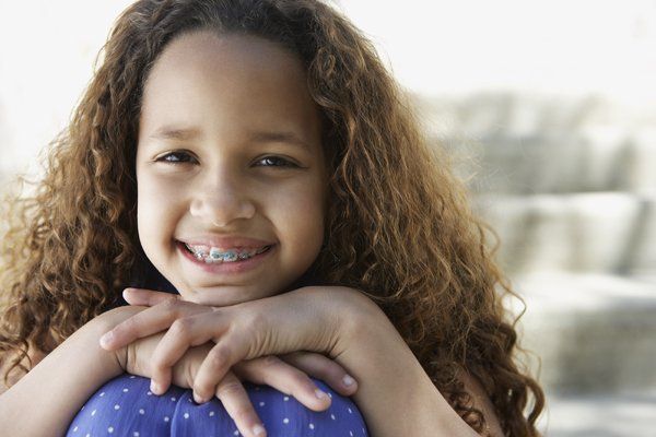 Little girl with curly hair and braces — Buffalo Grove, IL — Rosen Orthodontics