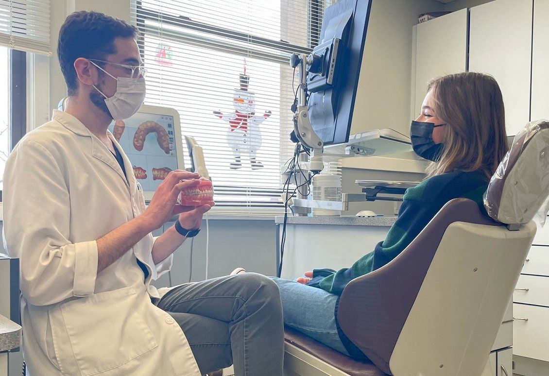 Male dentist talking to his patient — Buffalo Grove, IL — Rosen Orthodontics