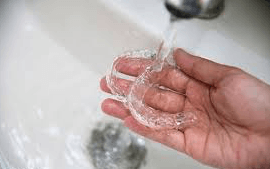 Cleaning clear retainer — Buffalo Grove, IL — Rosen Orthodontics