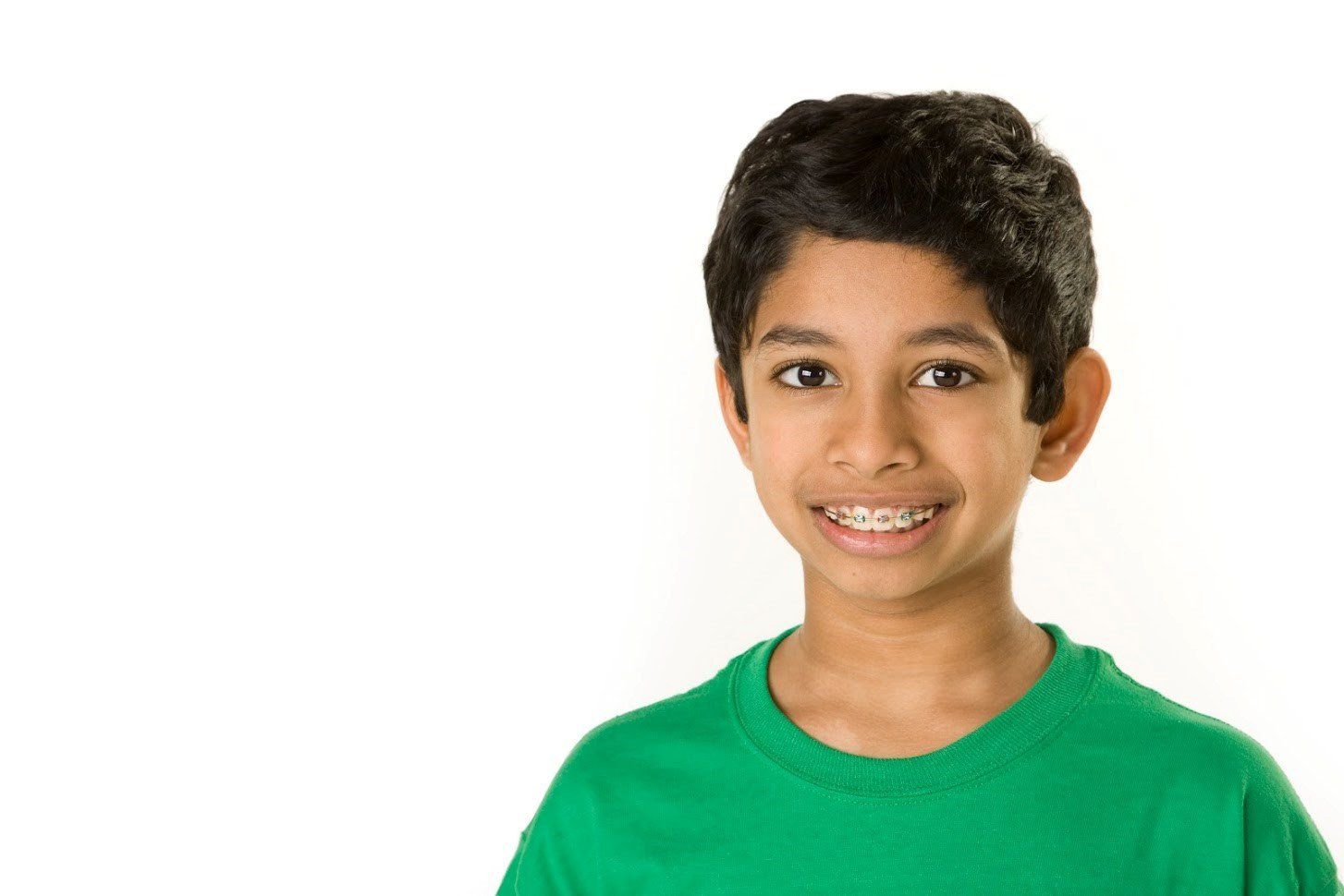 Boy with braces wearing green shirt — Buffalo Grove, IL — Rosen Orthodontics