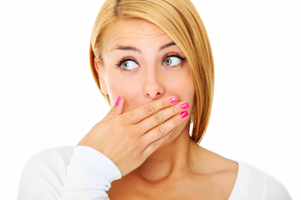 Woman covering her mouth — Buffalo Grove, IL — Rosen Orthodontics