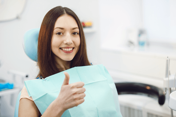 Woman thumbs up — Buffalo Grove, IL — Rosen Orthodontics