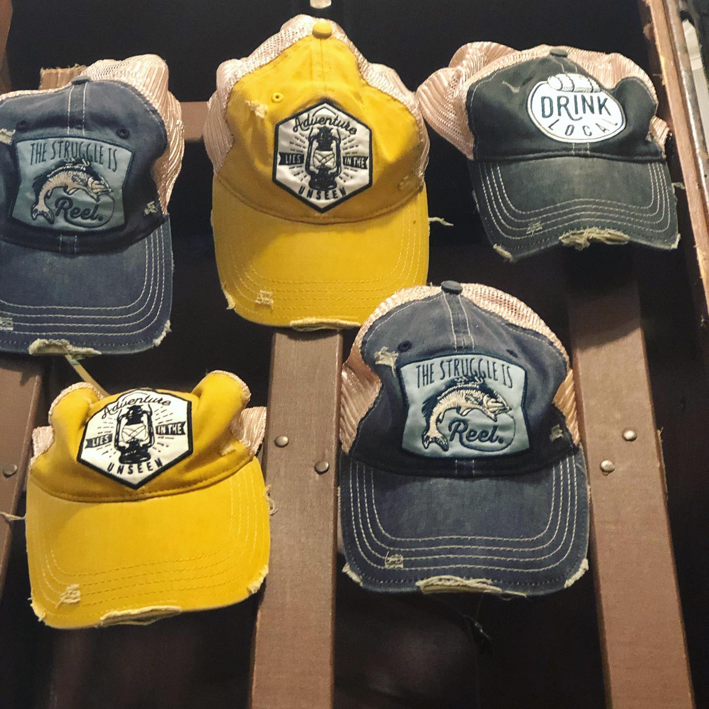 A bunch of hats with one that says drink on it