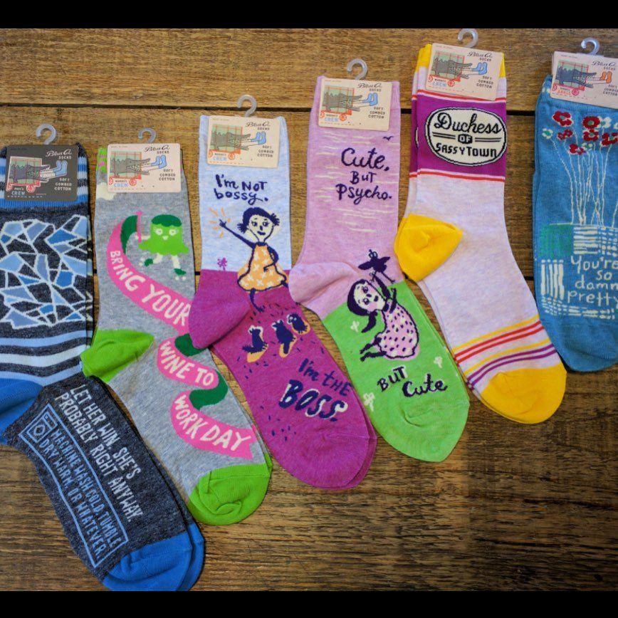 A bunch of socks with one that says i 'm cute but boss