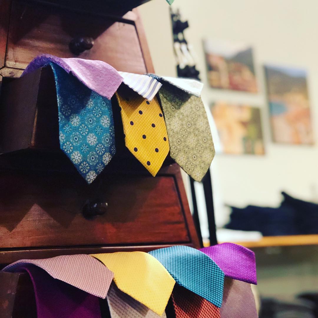 A bunch of ties are stacked on top of each other