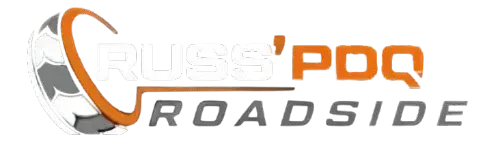 Company logo for Russ' PDQ Roadside, featuring a tire graphic integrated with orange and grey text.