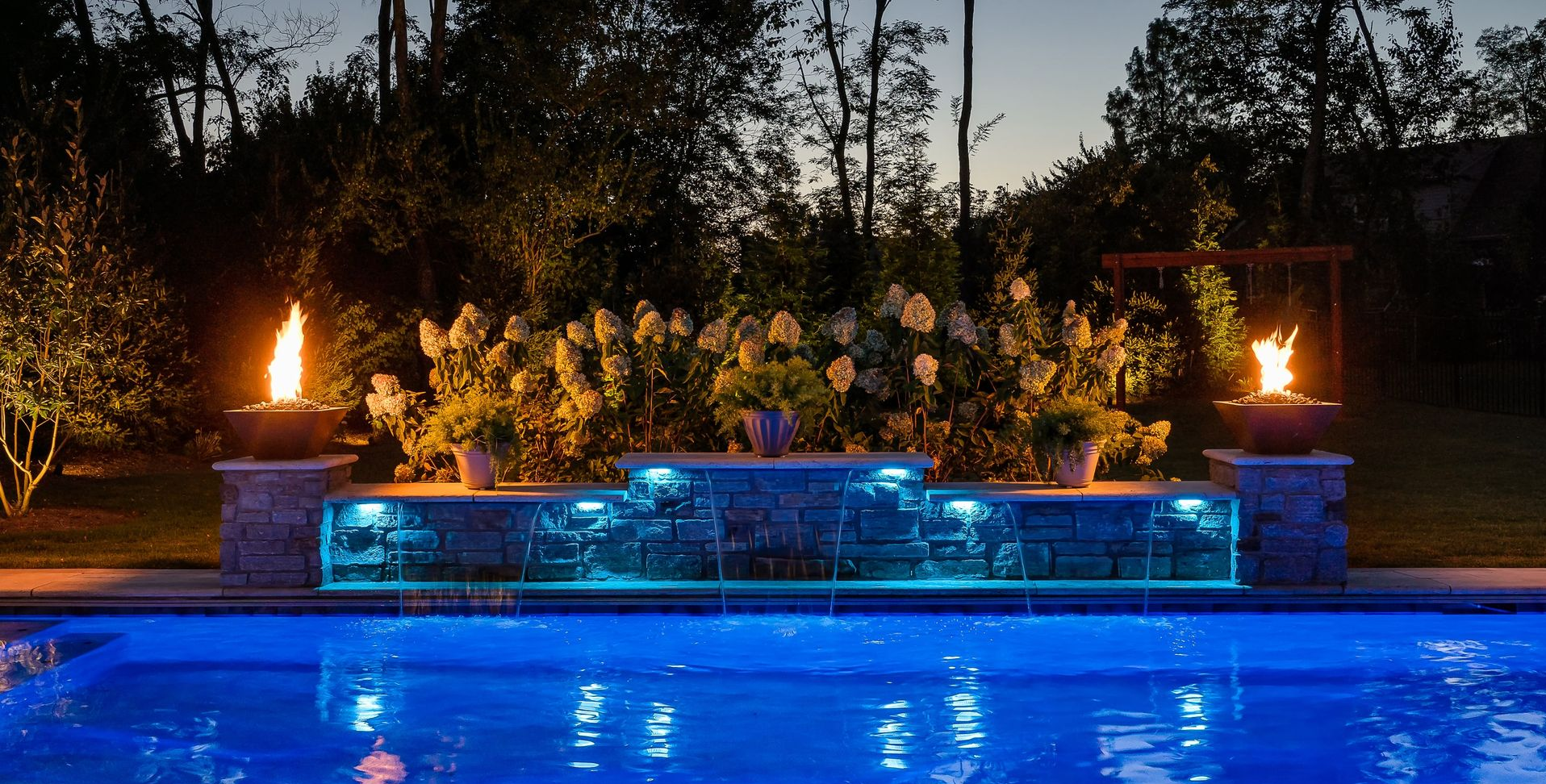 Elite Outdoor Living Solutions is installing a relaxing vibe resort-style pool with a waterfall in Oklahoma City.