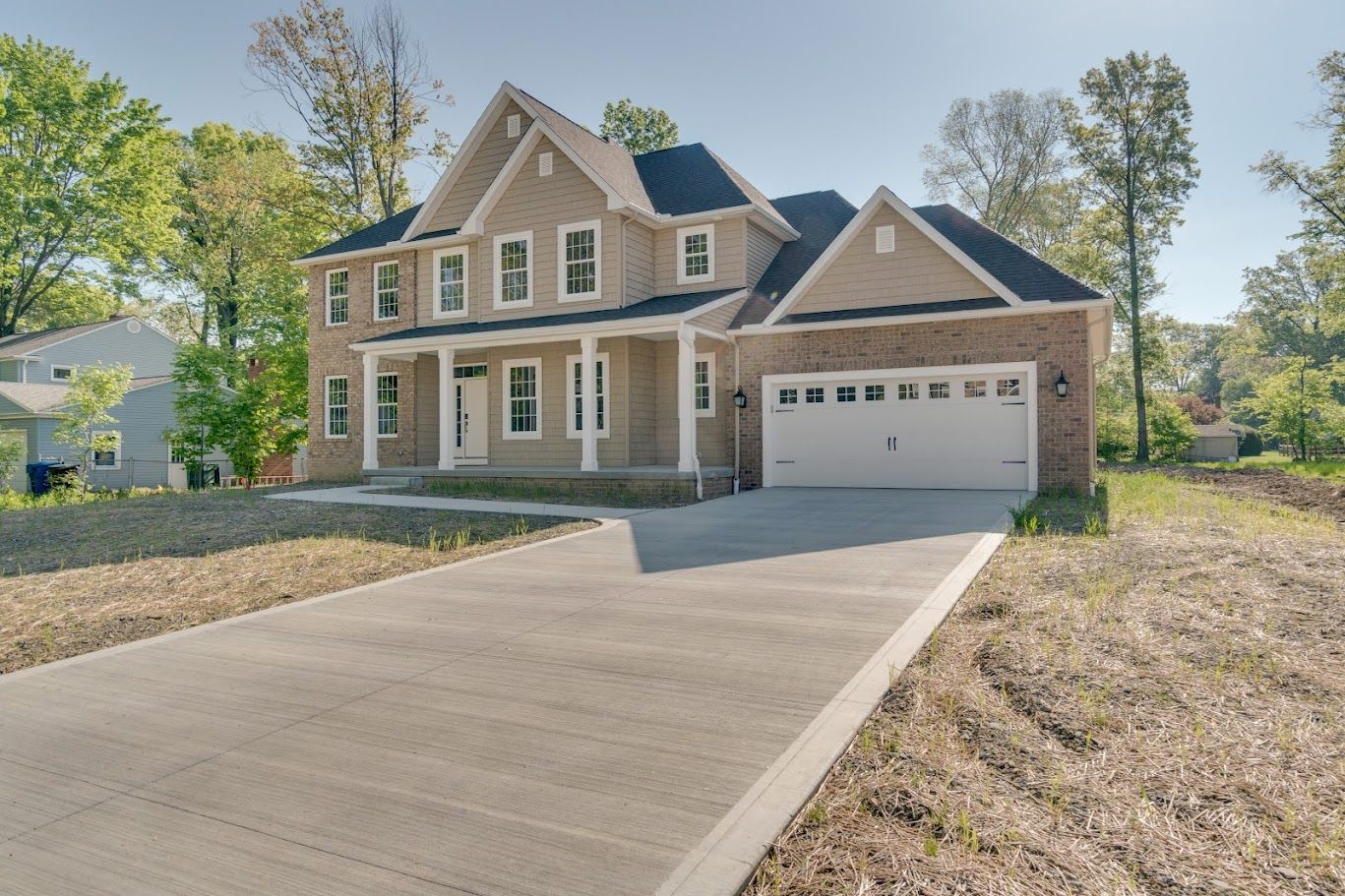 Elite Outdoor Living Solutions is installing a stunning concrete driveway for a brick home in Oklahoma City.