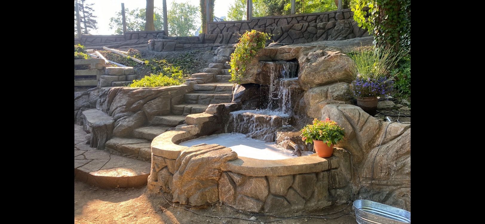 Elite Outdoor Living Solutions is installing a nature-like vibe garden waterfall feature in Oklahoma City.