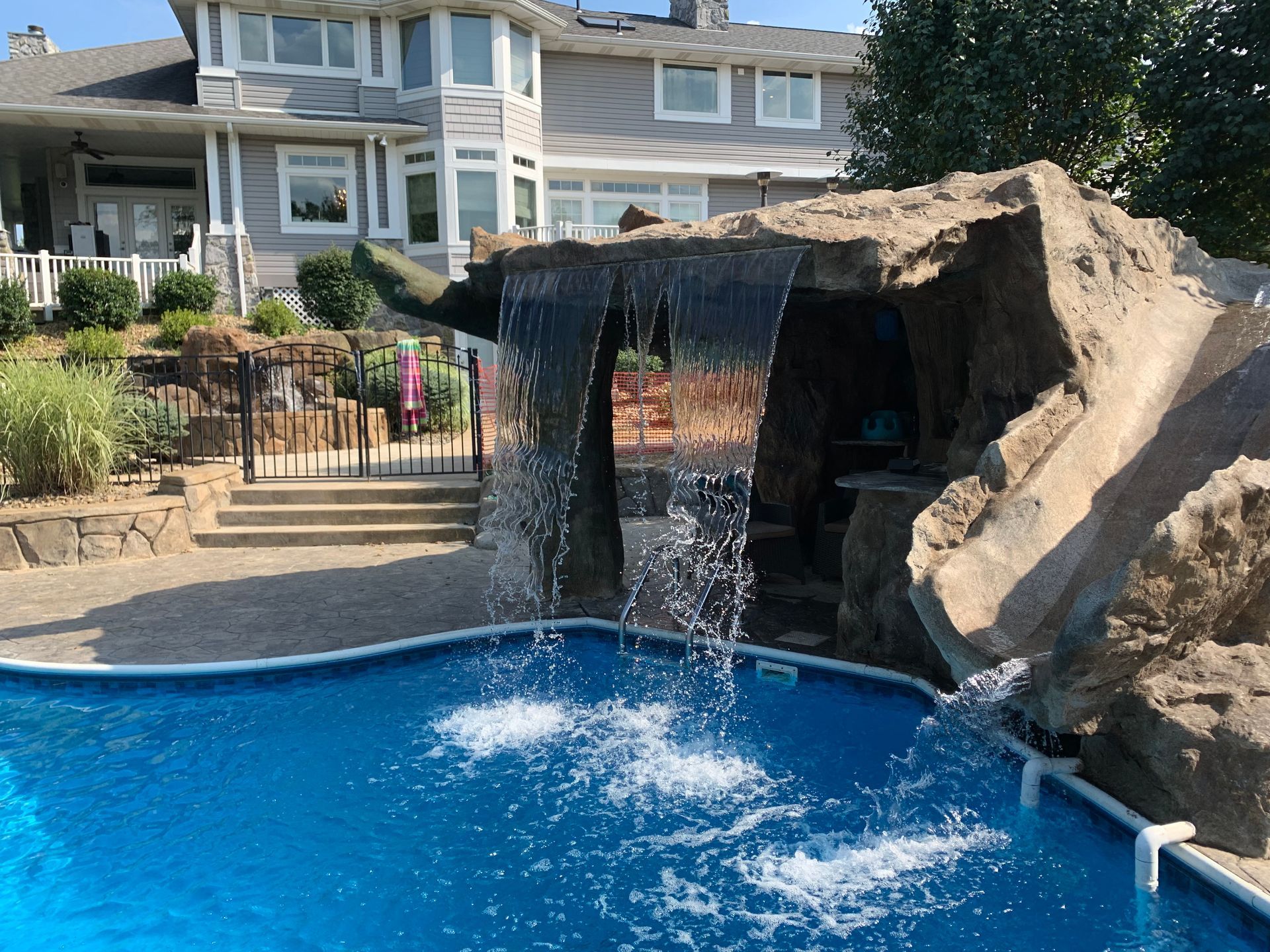 Elite Outdoor Living Solutions is installing a stunning custom pool with a rock waterfall in Oklahoma City.