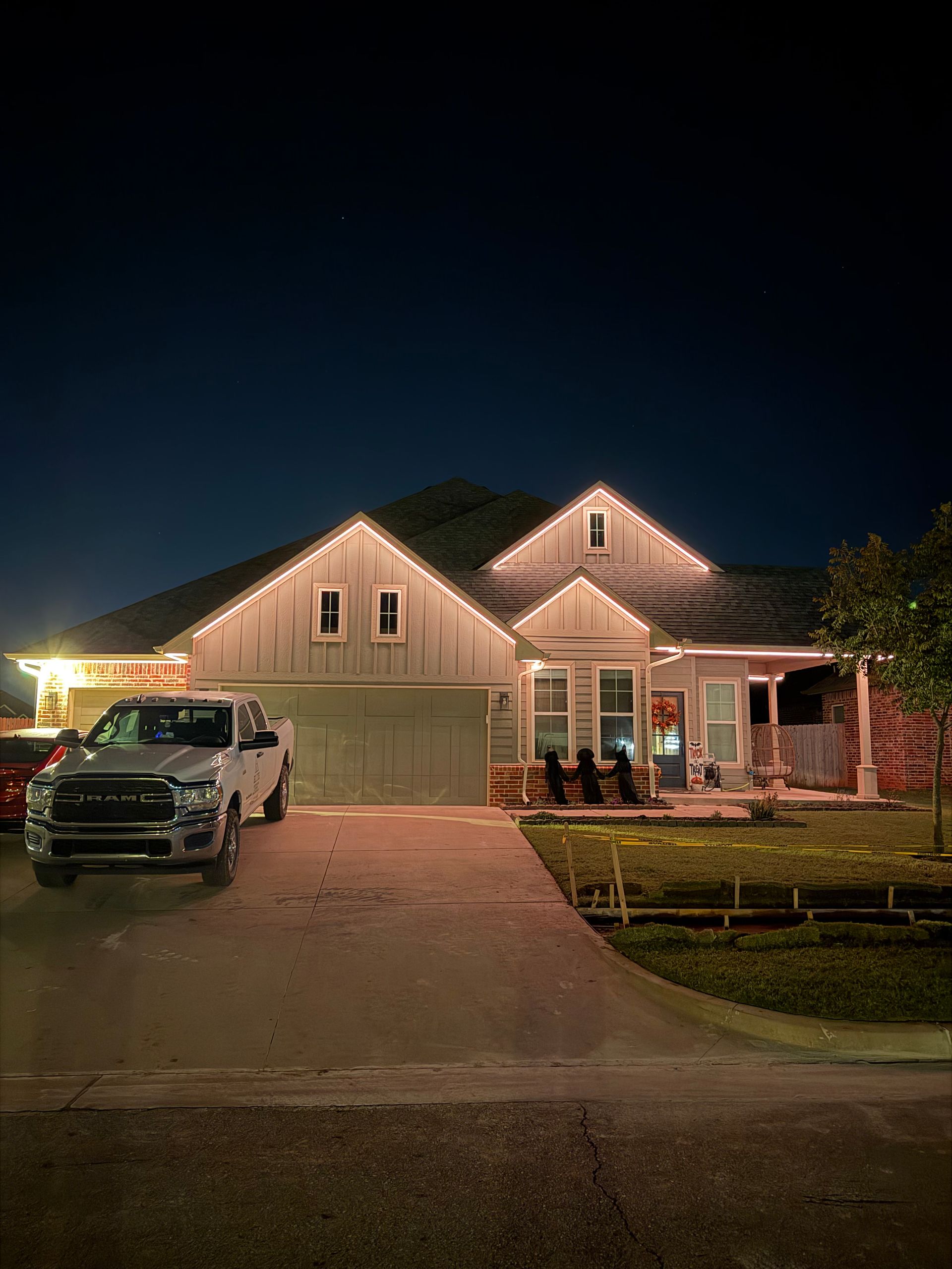 Elite Outdoor Living Solutions installed a custom stone fire pit with surrounding patio seating in Heritage Hills, OKC.