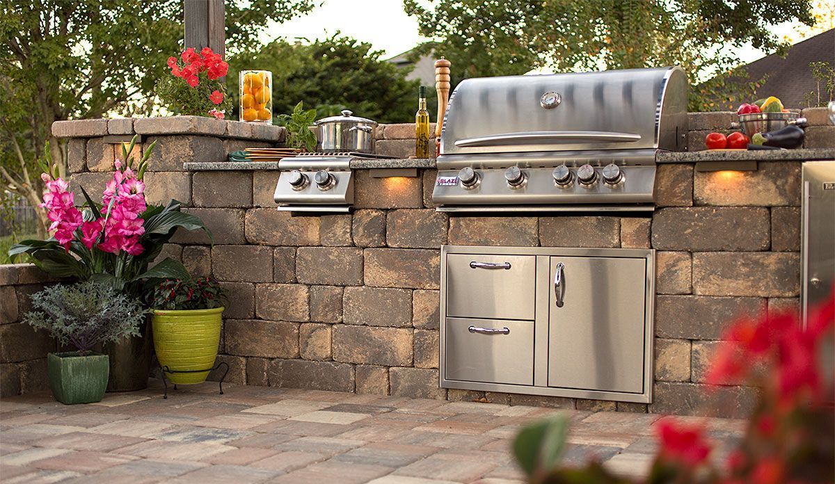 Elite Outdoor Living Solutions installed a grill and brick wall in an outdoor kitchen in Mesta Park, OKC.