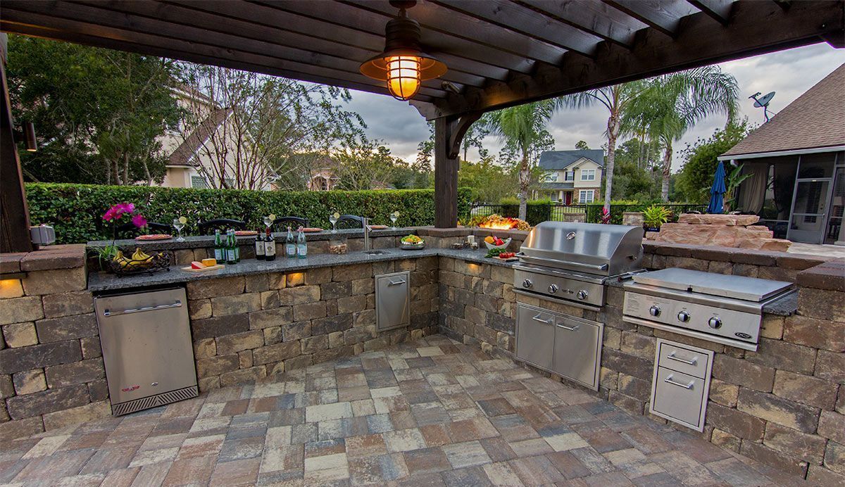 Elite Outdoor Living Solutions installed an outdoor kitchen with a grill and pergola in Gaillardia, OKC.