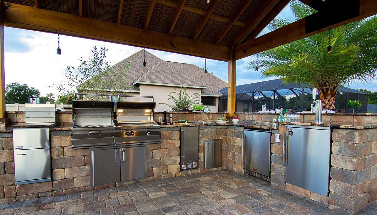 Elite Outdoor Living Solutions built an outdoor kitchen with stainless appliances in Nichols Hills, OKC.