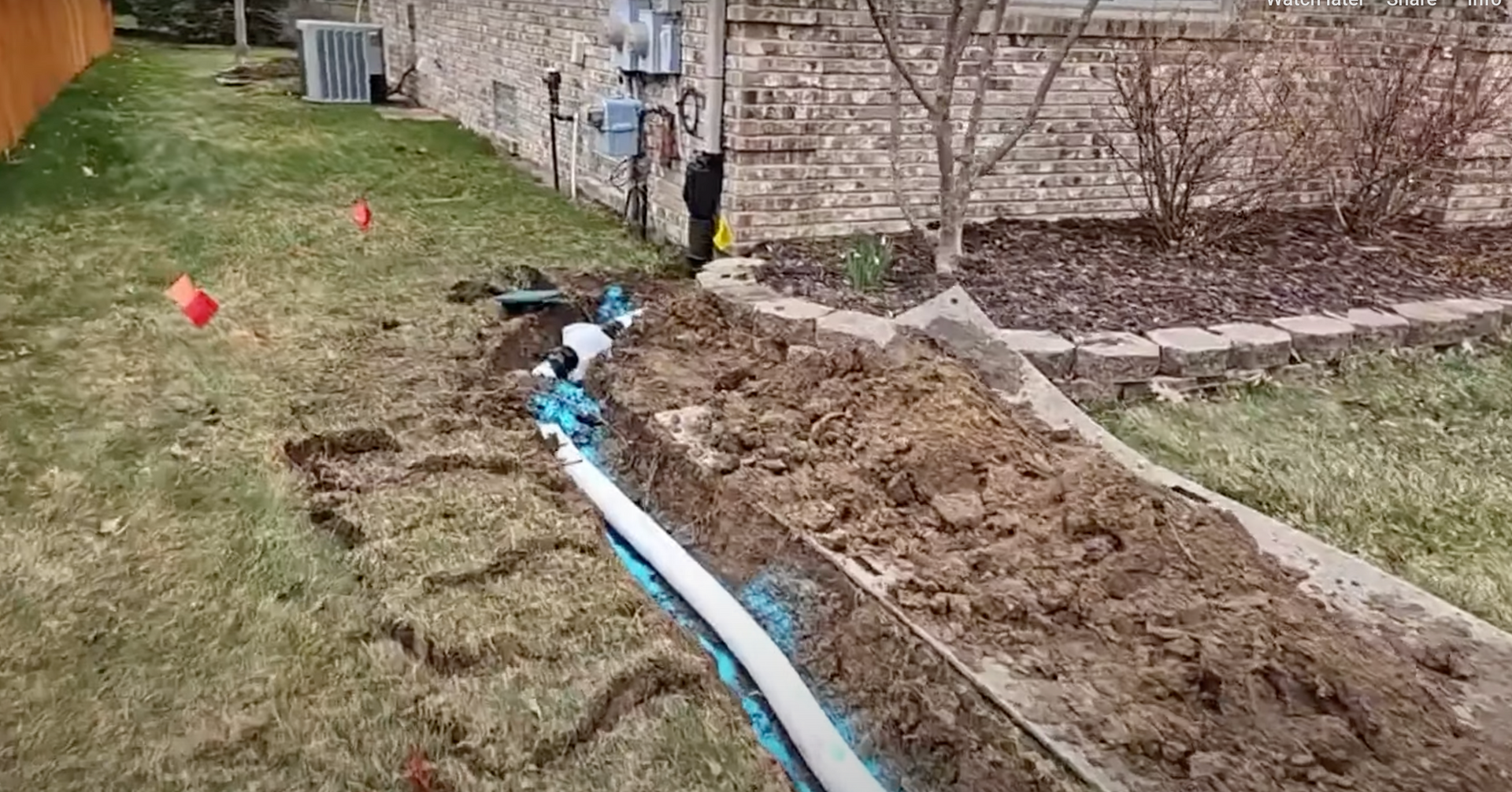 Elite Outdoor Living Solutions is installing a functional backyard drainage system in Heritage Hills, OKC.