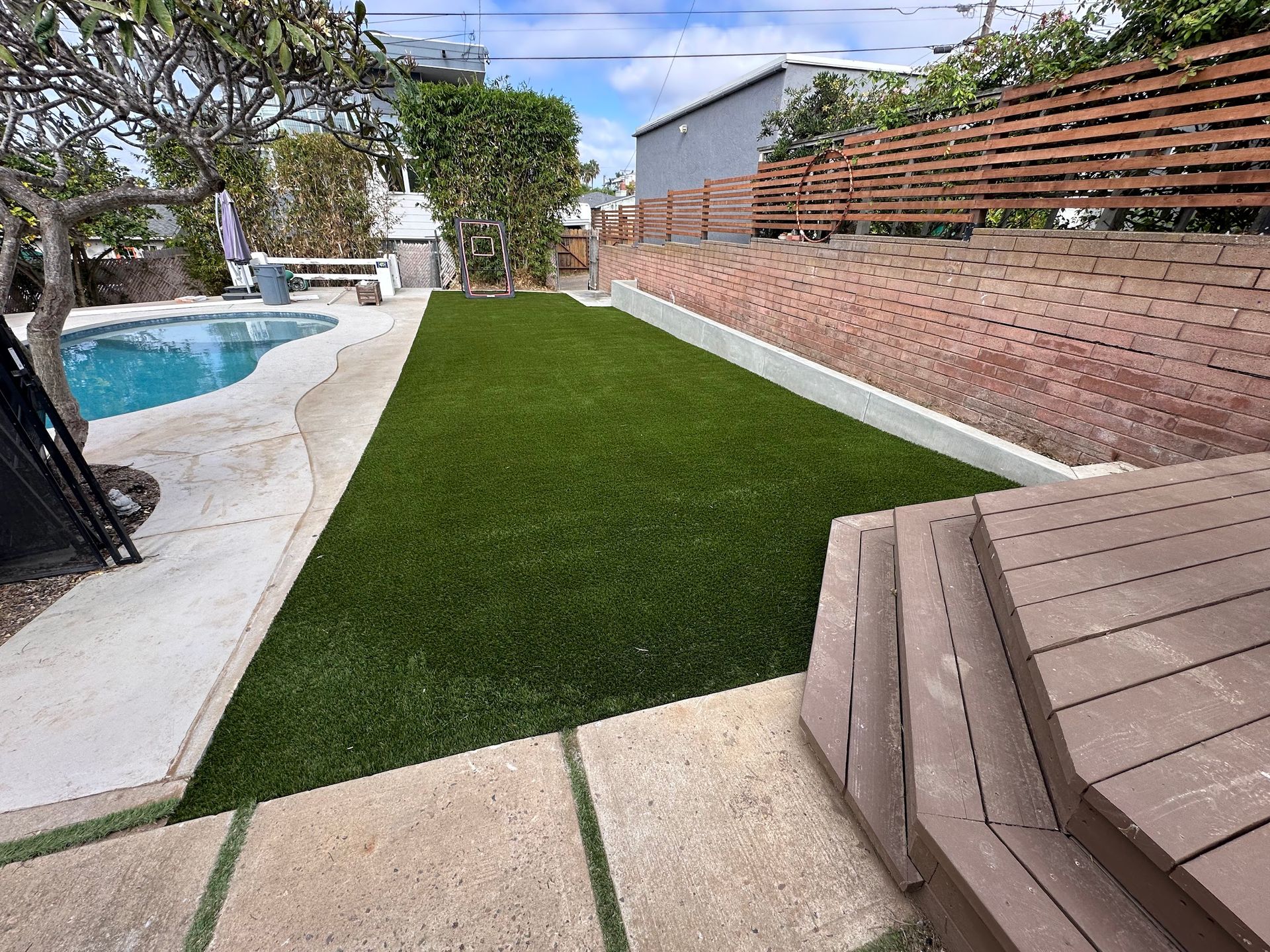 Elite Outdoor Living Solutions is installing a lush artificial lawn with a natural appearance in Oklahoma City.