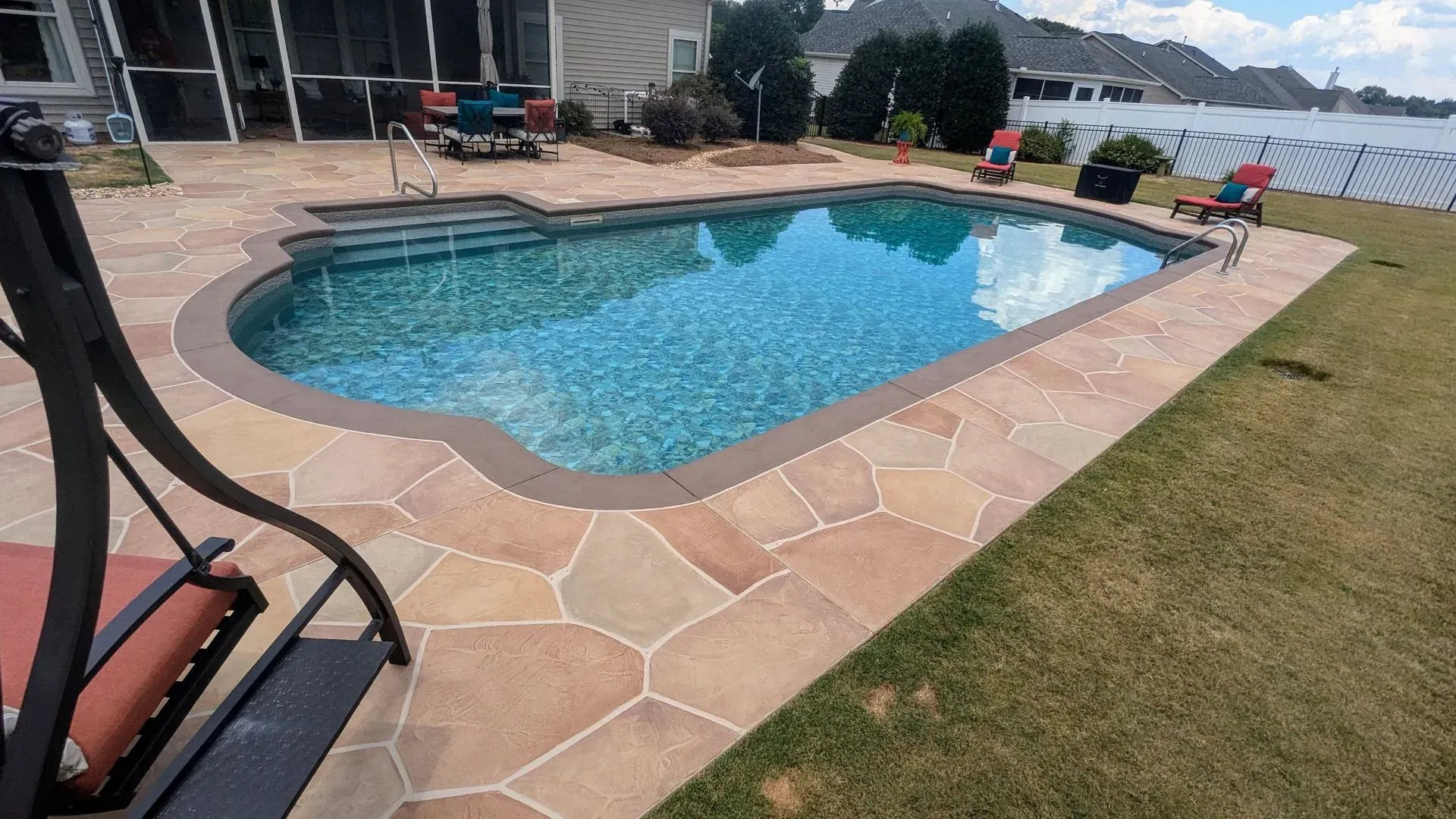  Elite Outdoor Living Solutions is installing a concrete pool deck with a built-in swing in Lakehurst, OKC.