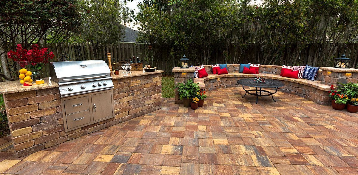 Elite Outdoor Living Solutions is installing a brick paver patio with a grill and bench in Yukon, OK.