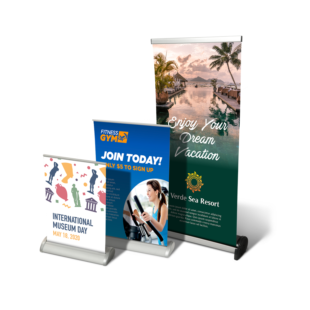 A group of signs sitting on top of each other on a table.