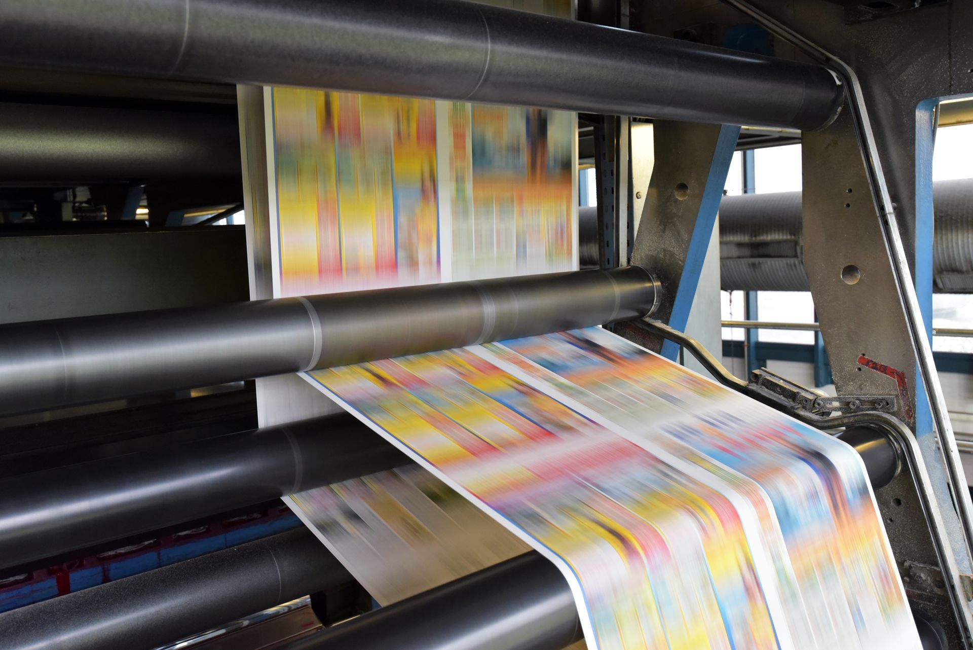 A bunch of papers are being printed on a machine