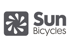 The sun bicycles logo is black and white and has a flower on it.