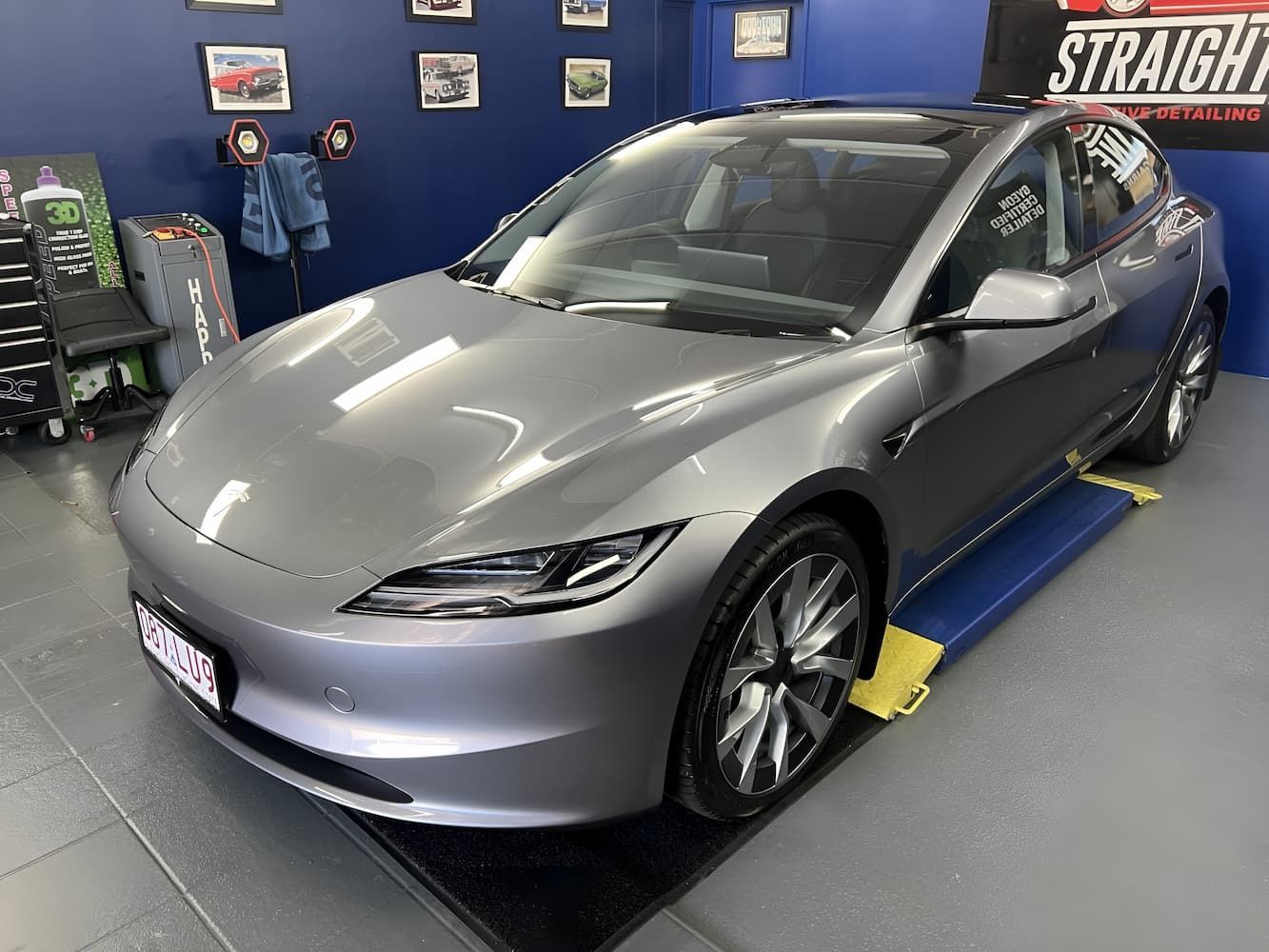 Silver Tesla Sedan in A Garage — Straightline Detailing Cairns in Bungalow, QLD